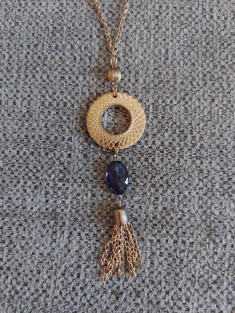 Gold-Tone Pendant Necklace with Blue Faceted Stone and Tassel